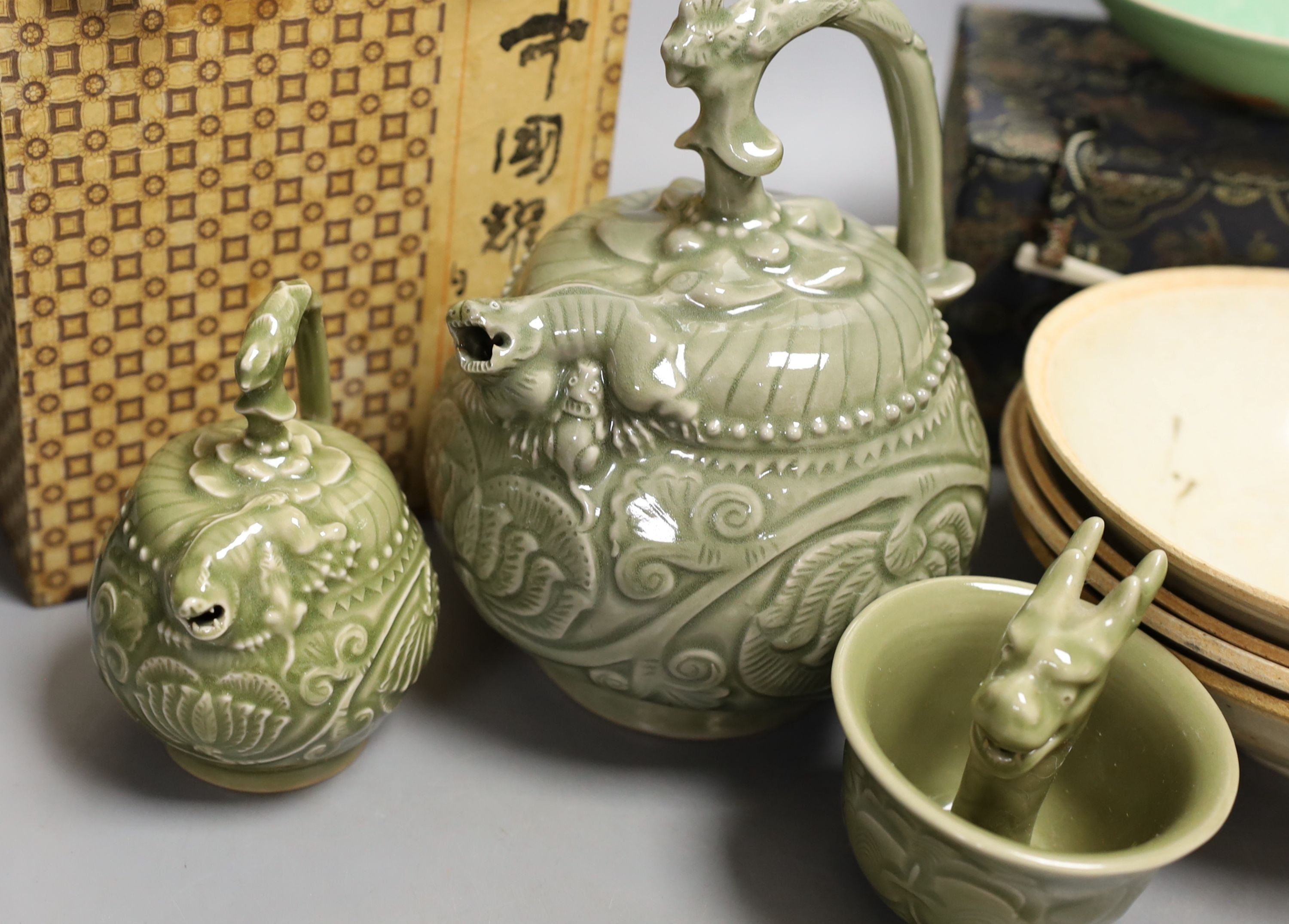 A group of Chinese celadon vessels and Qingbai type bowls, teapot 17 cms high.